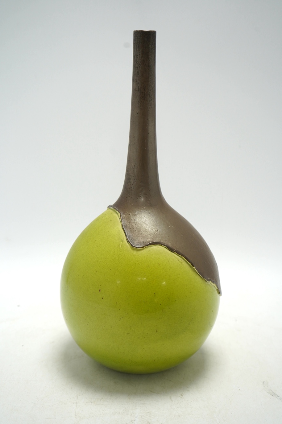 A Bretby two tone green and brown bottle vase, 31cm. Condition - fair, general crazing